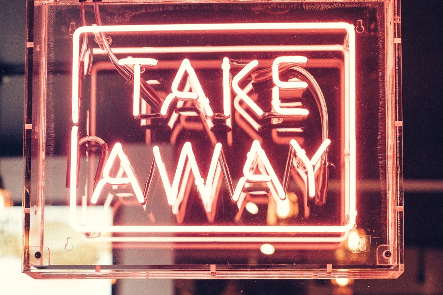 neon sign reading take away in all capital letters