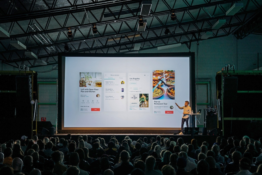 Presentation on large screen in front of audience